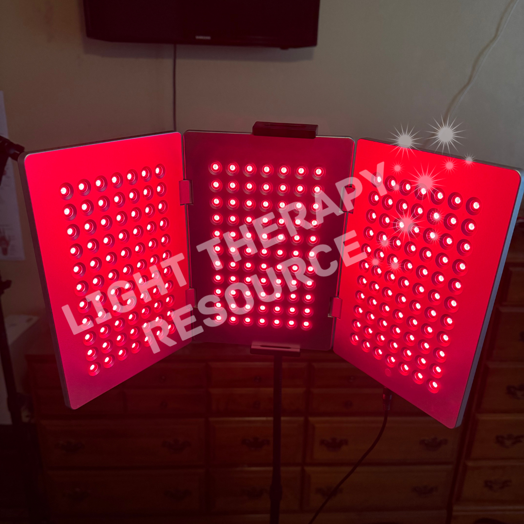 Red light therapy panel with 'Light Therapy Resource' text on a wooden surface.