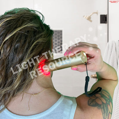 A woman using a handheld device emitting red light on her neck, with text overlay 'Light Therapy Resource.'
